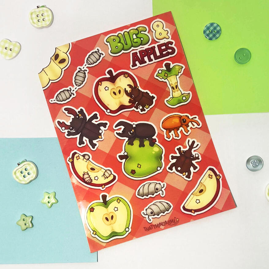 Image shows a sticker sheet containing various bugs and apples