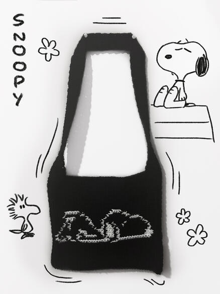 Image shows a black crochet bag with a white image of Snoopy on it